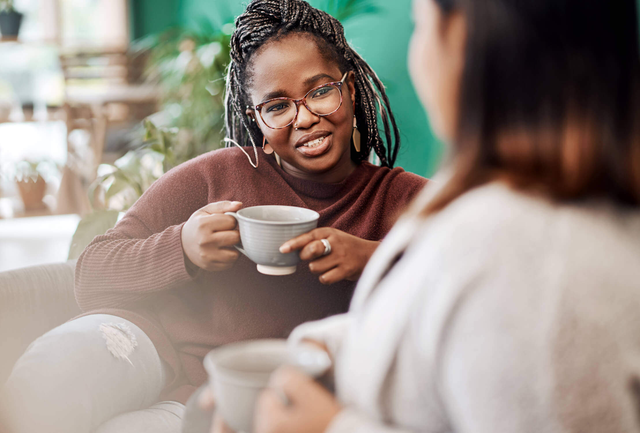 Woman drinking CBD Coffee